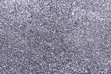 Beautiful shiny grey glitter as background, closeup