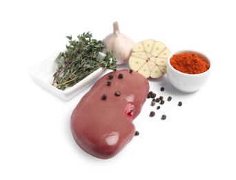 Photo of Fresh raw pork kidney with spices on white background