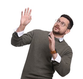 Portrait of scared bearded businessman avoiding something on white background