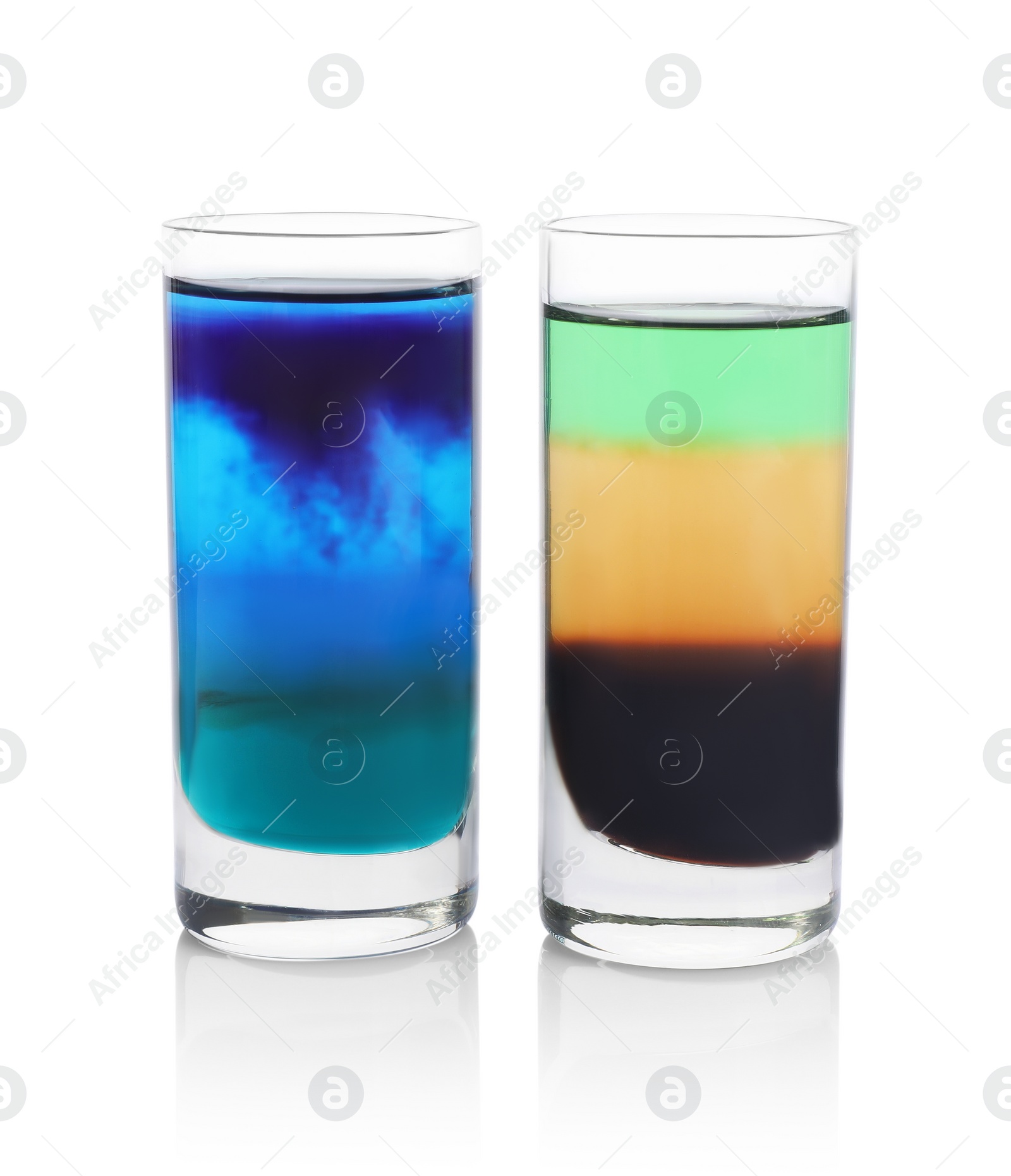 Photo of Two shooters in shot glasses isolated on white