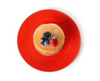 Photo of Plate with stack of tasty pancakes and fresh berries on white background, top view