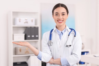 Portrait of medical consultant with stethoscope in clinic