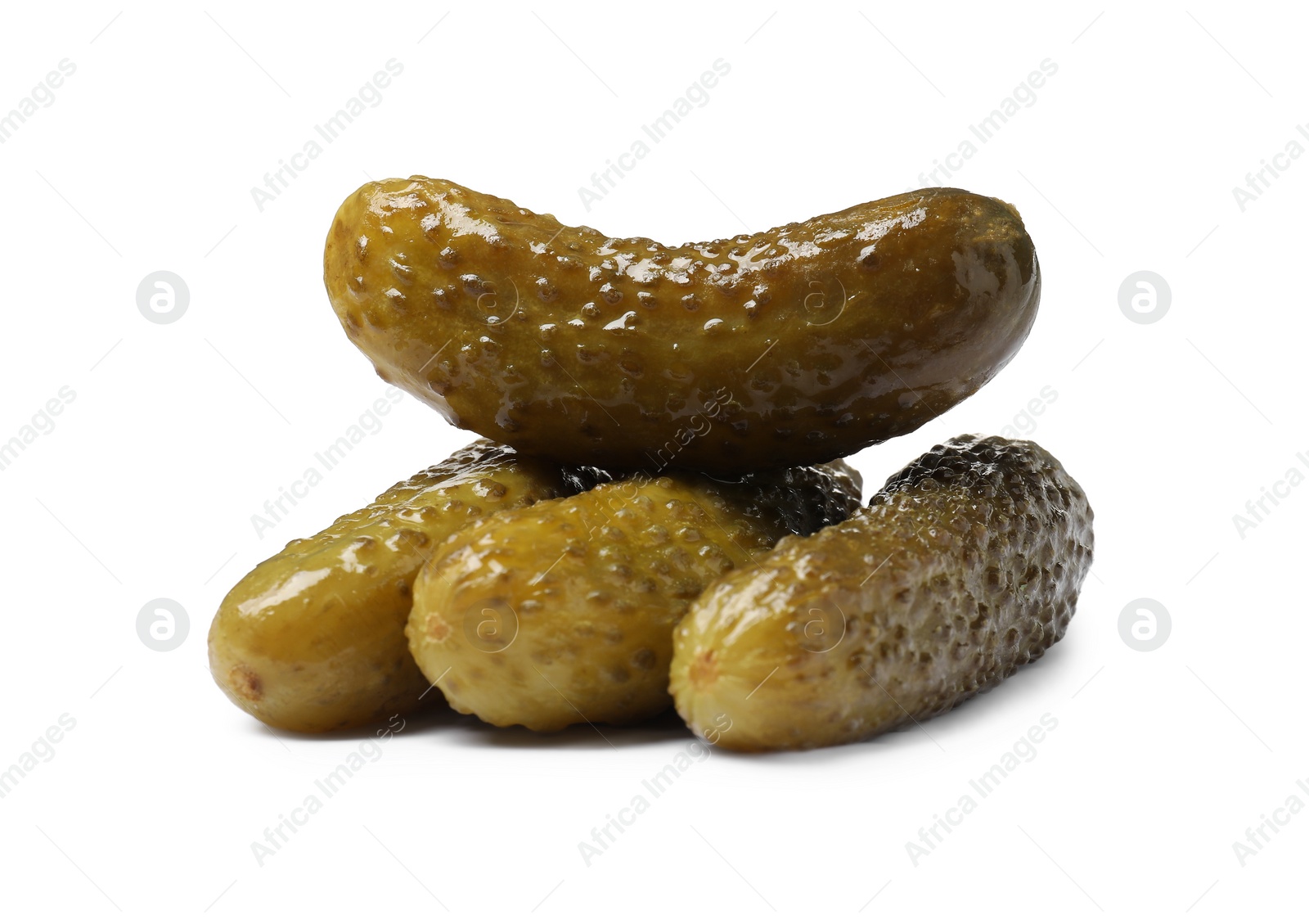 Photo of Pile of tasty pickled cucumbers isolated on white