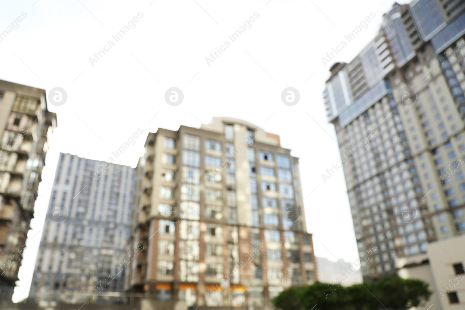 Photo of Blurred view of modern buildings with windows. Urban architecture