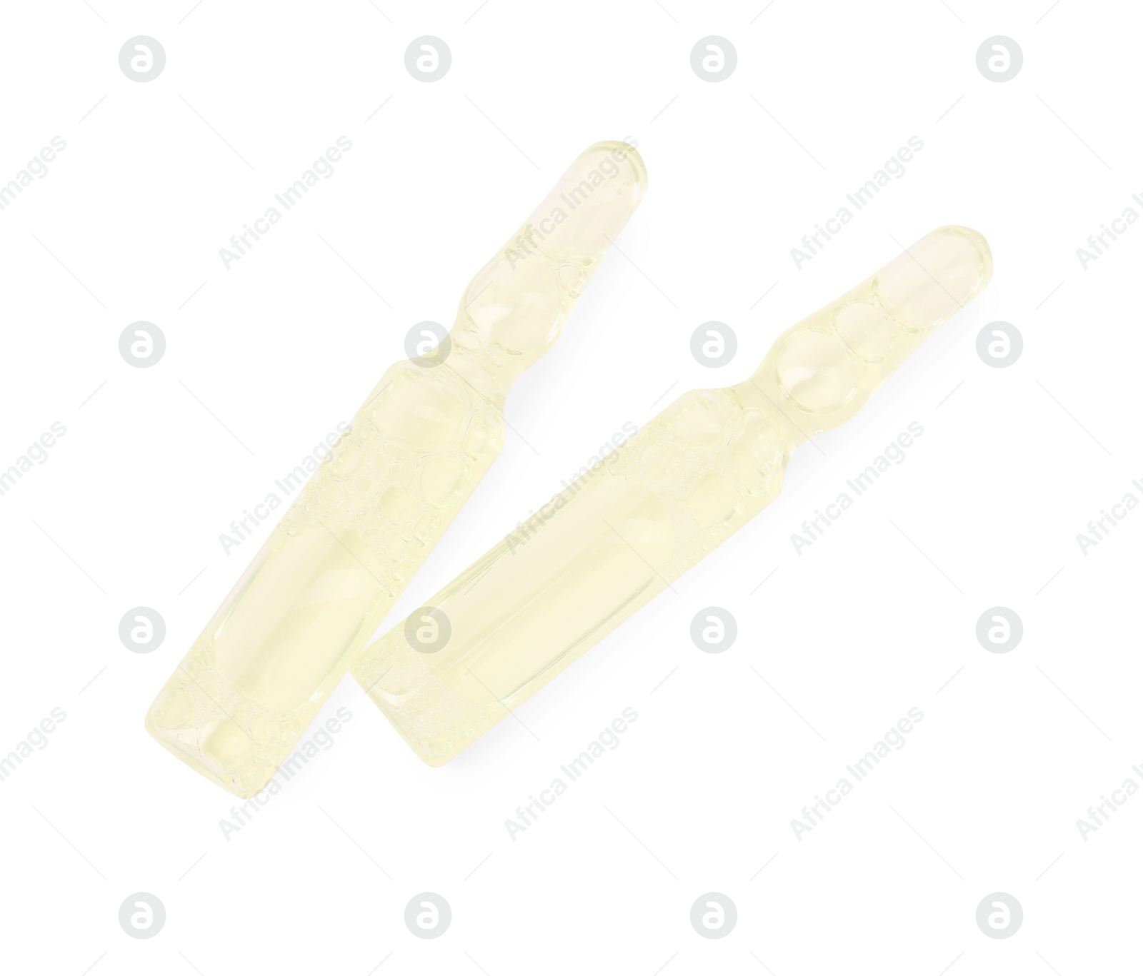 Photo of Glass ampoules with liquid isolated on white, top view