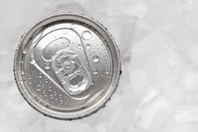 Energy drink in wet can on light background, top view. Space for text