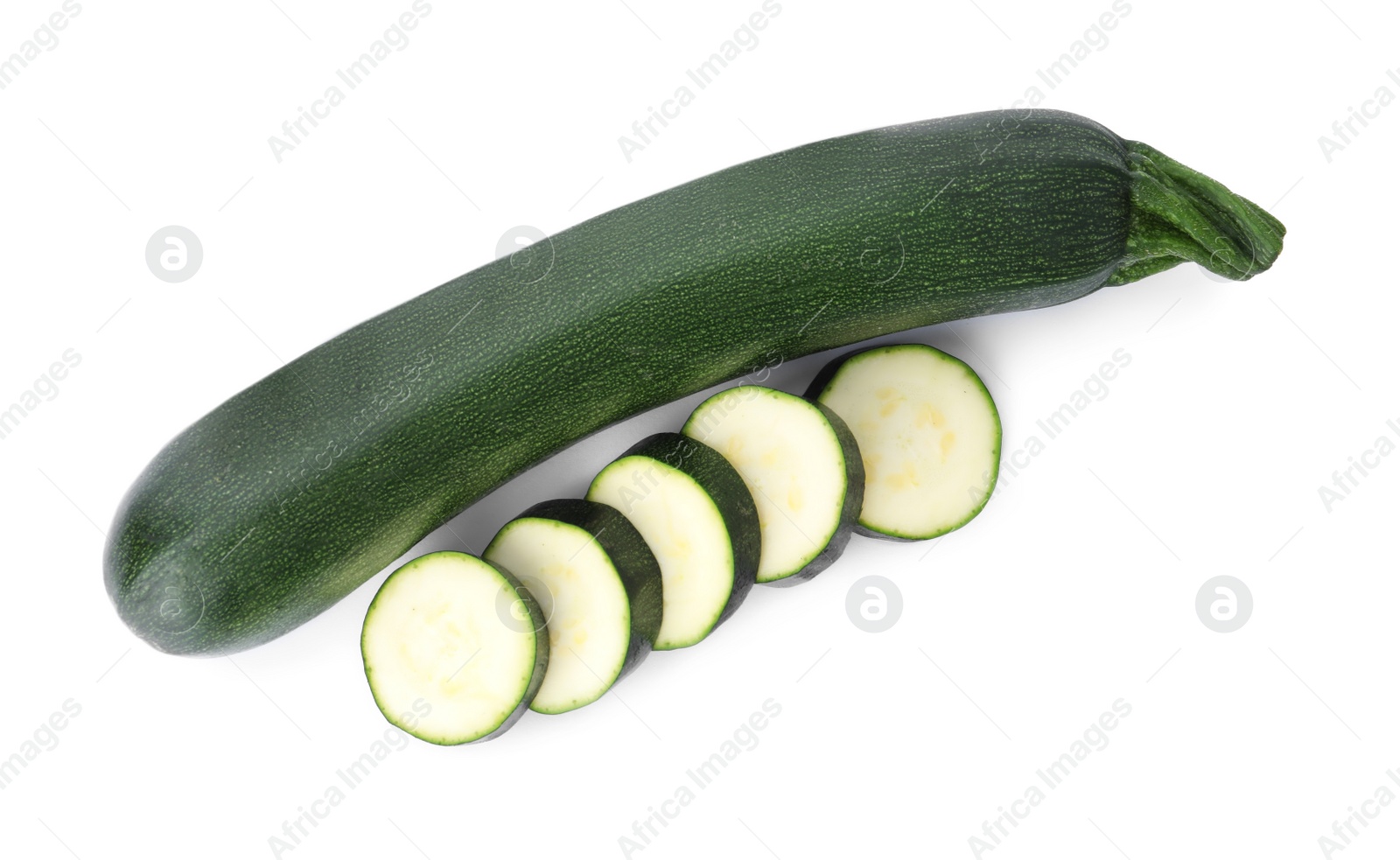 Photo of Cut and whole green ripe zucchini isolated on white, top view