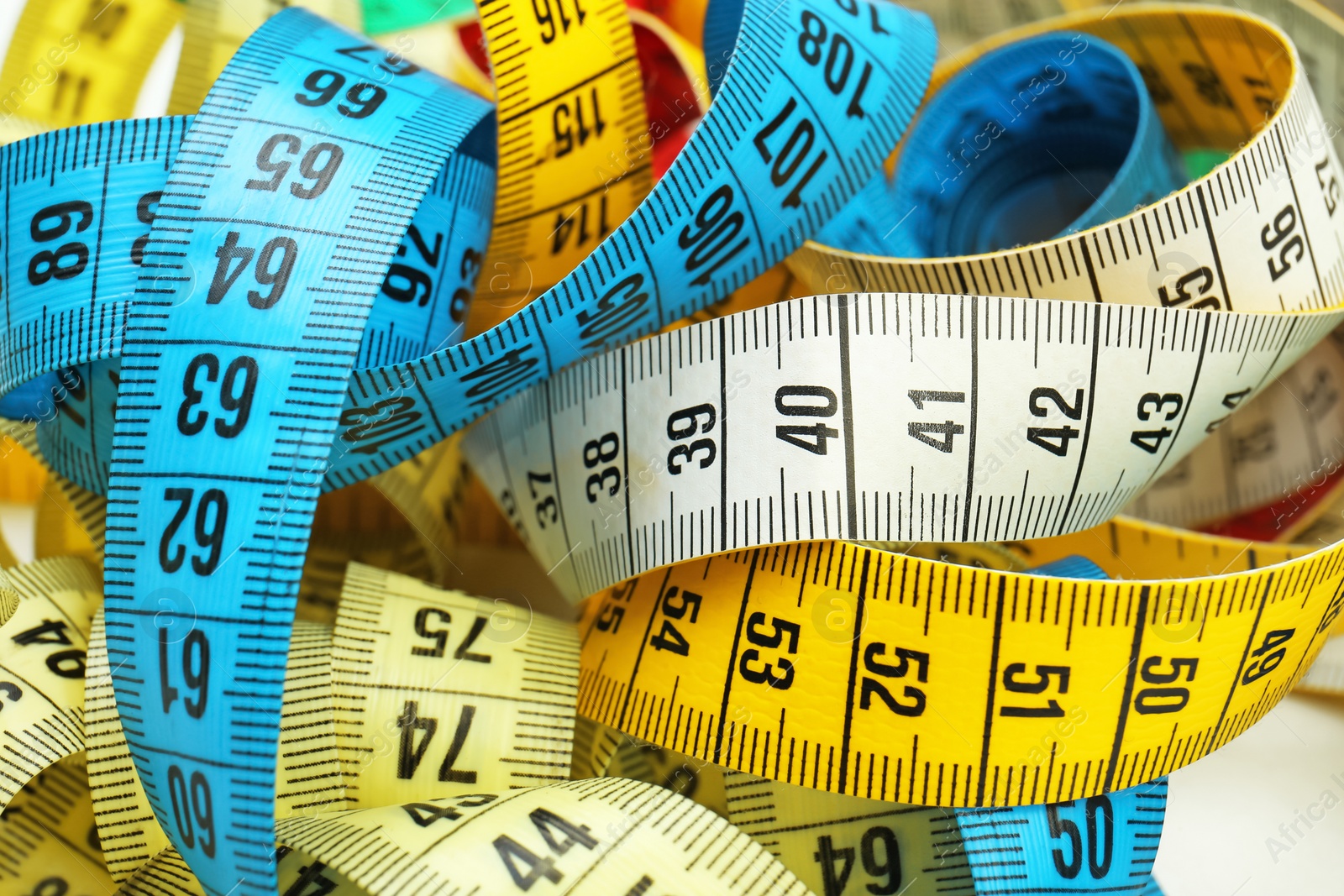 Photo of Different measuring tapes, closeup