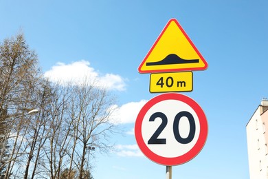 Different traffic signs on city street, space for text