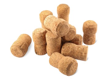 Photo of Heap of sparkling wine corks on white background