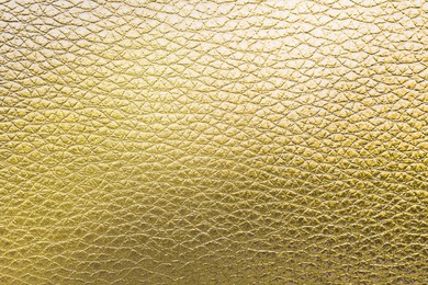 Image of Golden textured surface as background, closeup view