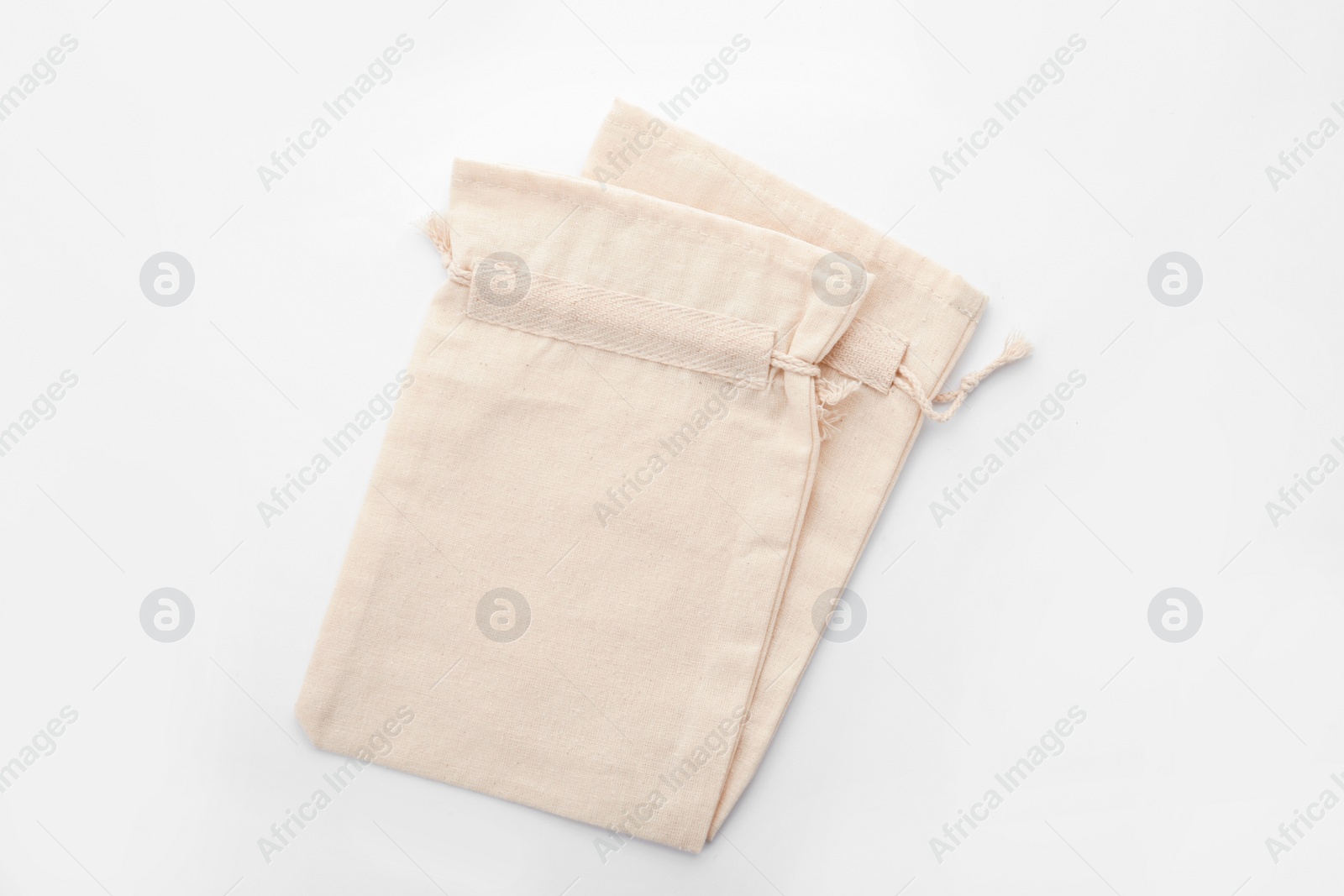 Photo of Cotton eco bags isolated on white, top view