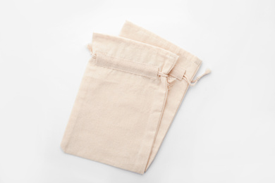 Photo of Cotton eco bags isolated on white, top view