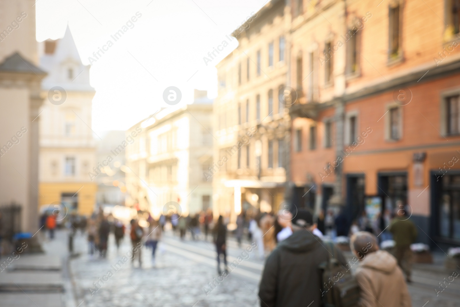 Photo of Blurred view of people walking on city street