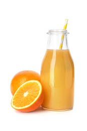 Photo of Glass bottle of orange juice and fresh fruit isolated on white