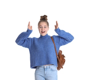 Emotional teenage girl with backpack on white background