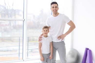 Photo of Dad and his son in gym
