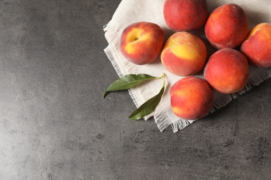 Photo of Fresh sweet peaches on table, top view