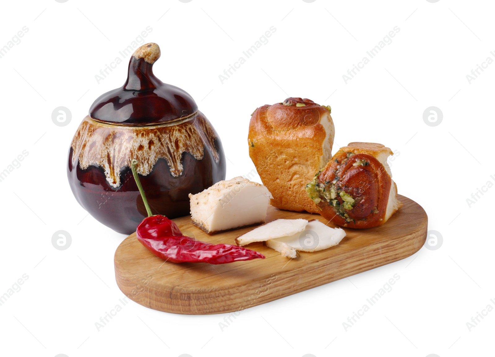 Photo of Delicious pampushky (buns), salo and pepper served for borsch isolated on white