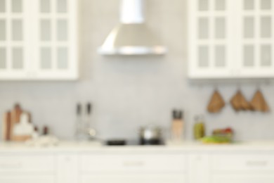 Photo of Blurred view of modern kitchen. Interior design