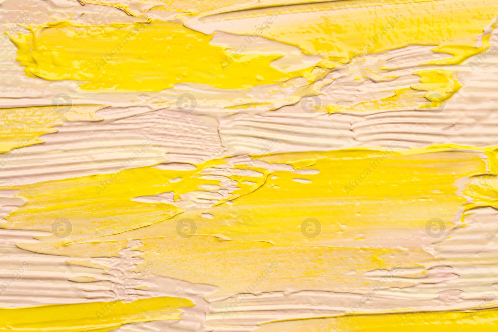 Photo of Beautiful strokes of colorful oil paints as background, closeup