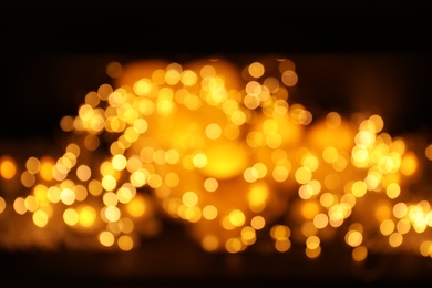 Gold glitter with bokeh effect on dark background