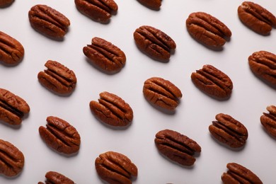 Photo of Delicious fresh pecan nuts on white background, flat lay