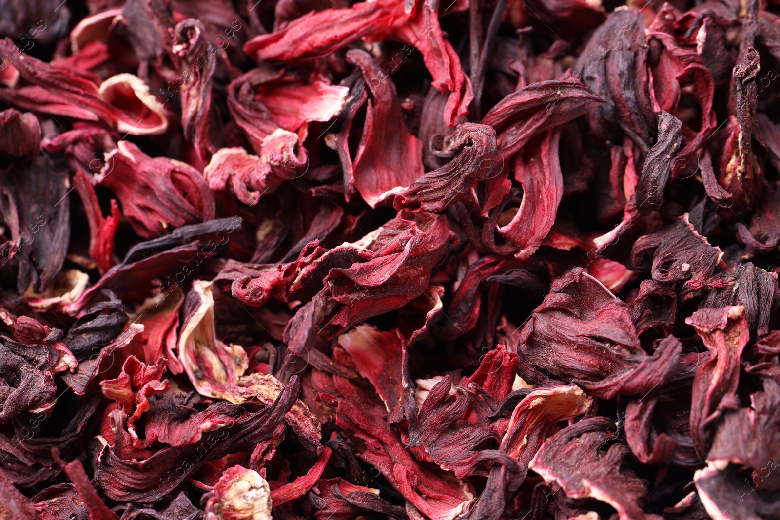 Photo of Dry hibiscus tea as background, closeup view