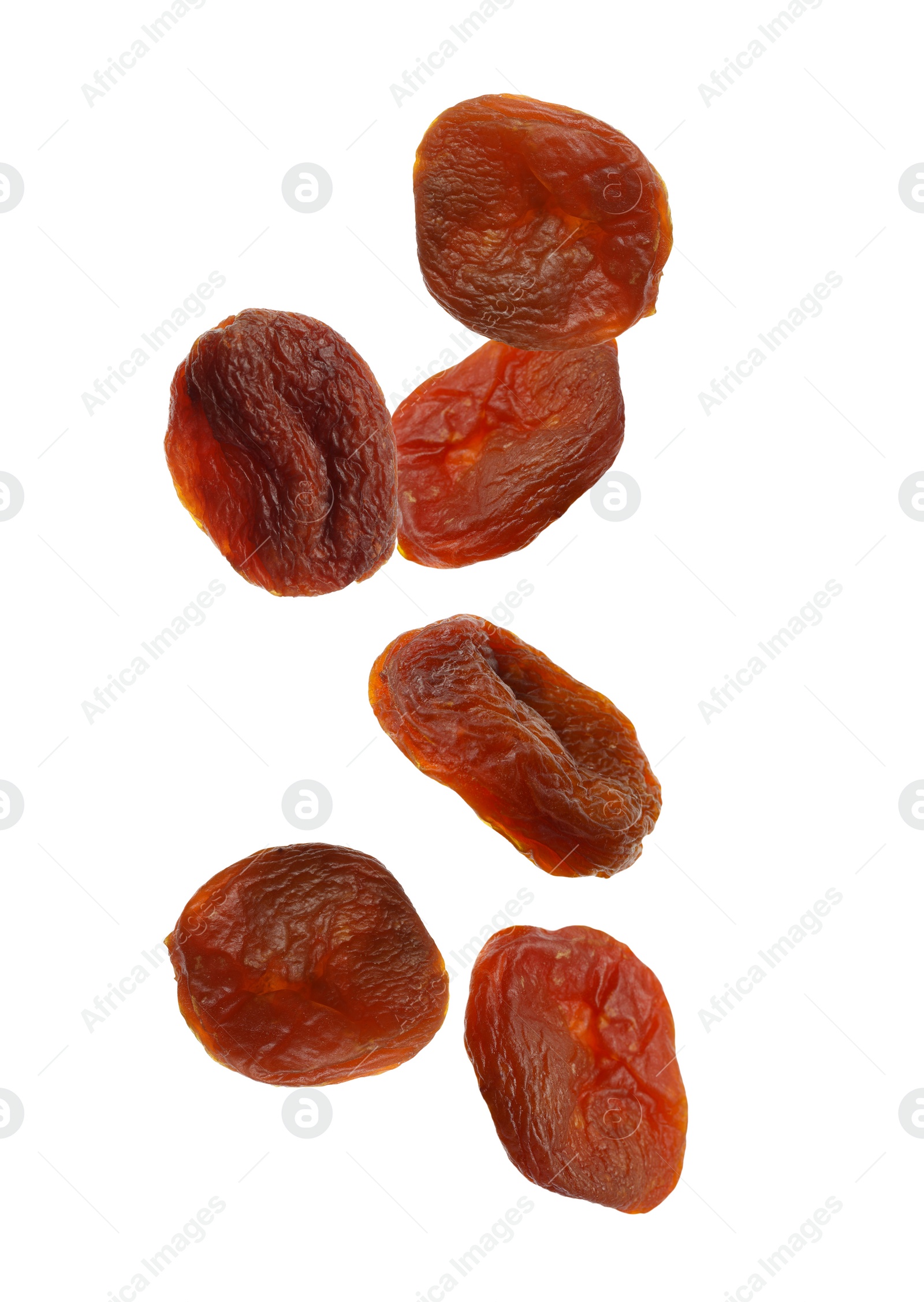 Image of Many tasty dried apricots on white background