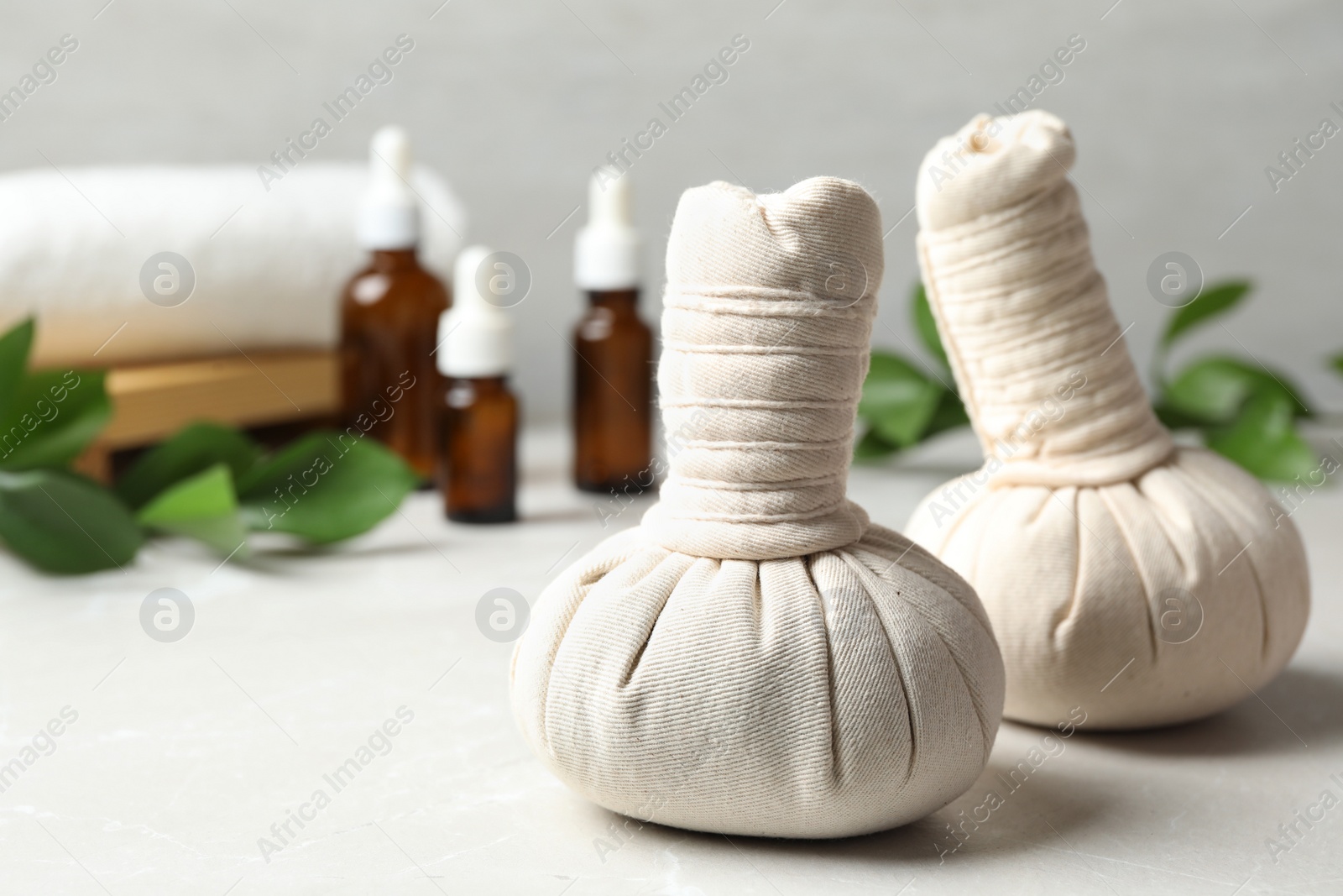 Photo of Herbal bags for spa massage on table