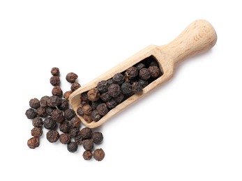 Photo of Aromatic spice. Many black peppercorns in scoop isolated on white, top view