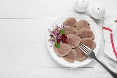 Photo of Tasty beef tongue pieces, berries and red onion on white wooden table, flat lay. Space for text