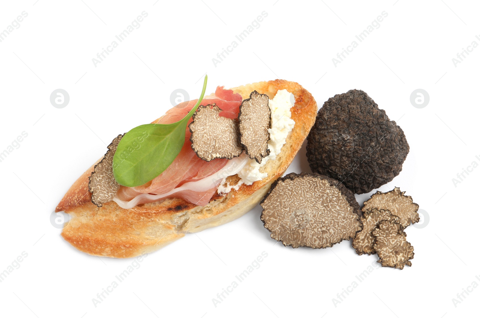 Photo of Tasty bruschetta with prosciutto and truffle on white background, top view