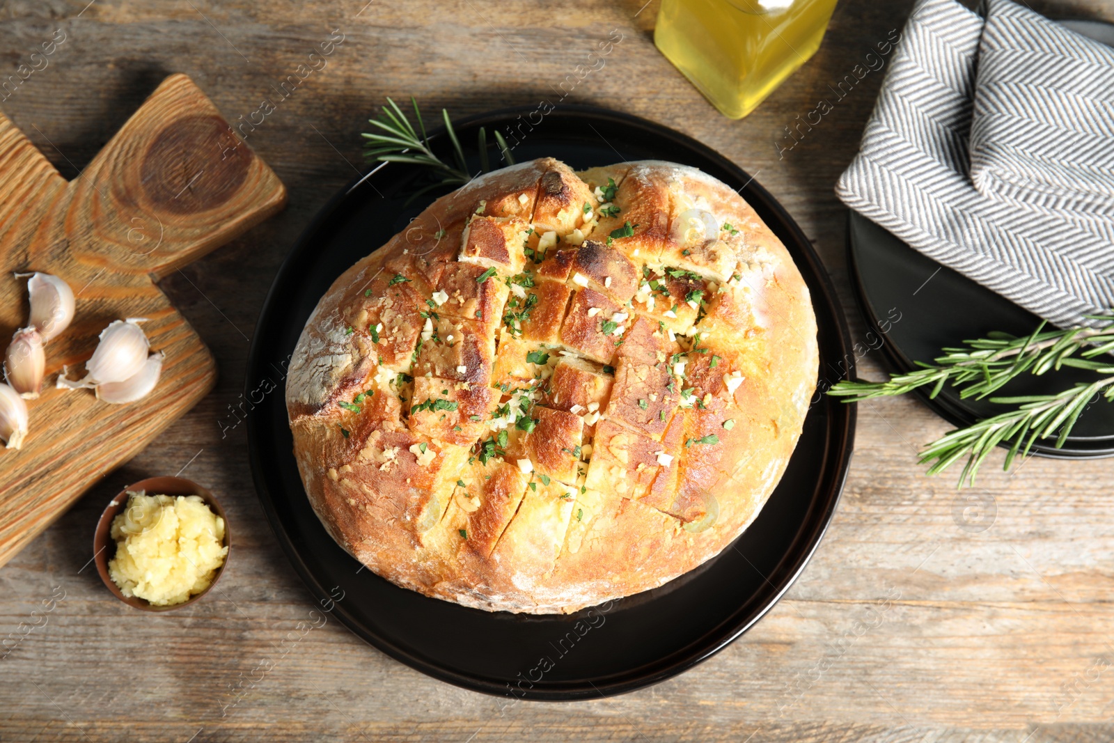 Photo of Flat lay composition with homemade garlic bread on table