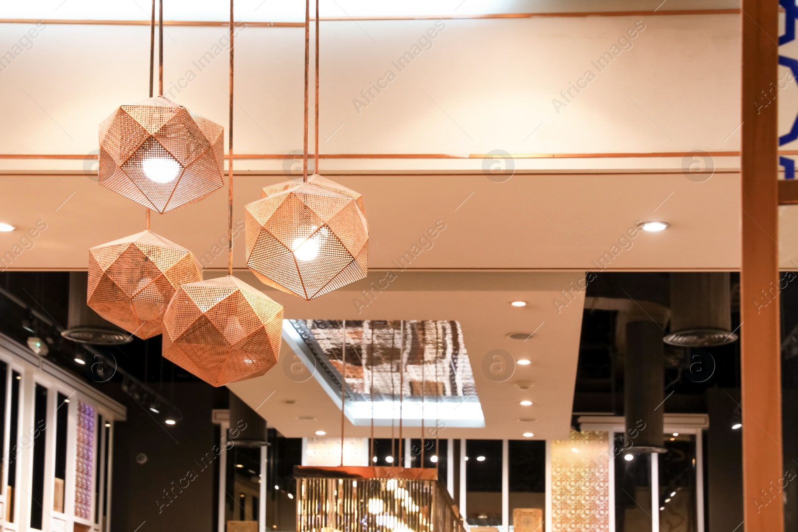 Photo of DUBAI, UNITED ARAB EMIRATES - NOVEMBER 04, 2018: Stylish pendant lamps in luxury shopping mall