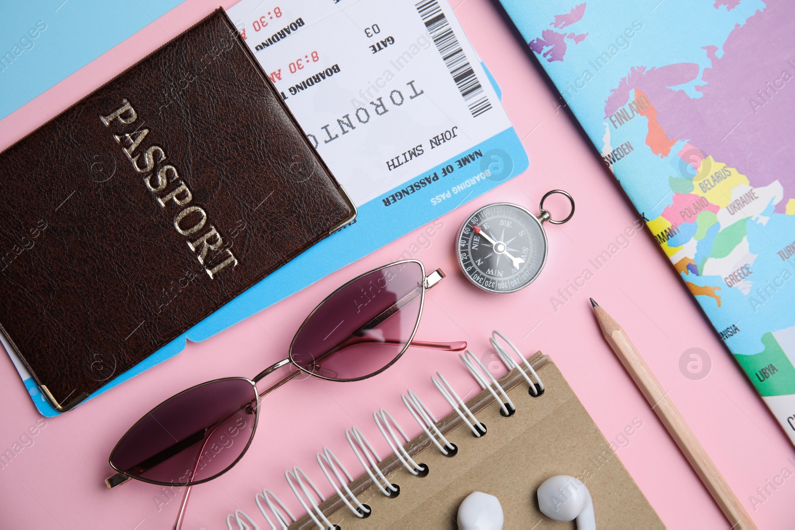 Photo of Flat lay composition with passport, tickets and travel items on color background