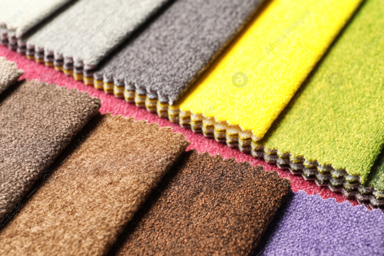 Photo of Fabric samples of different colors for interior design as background