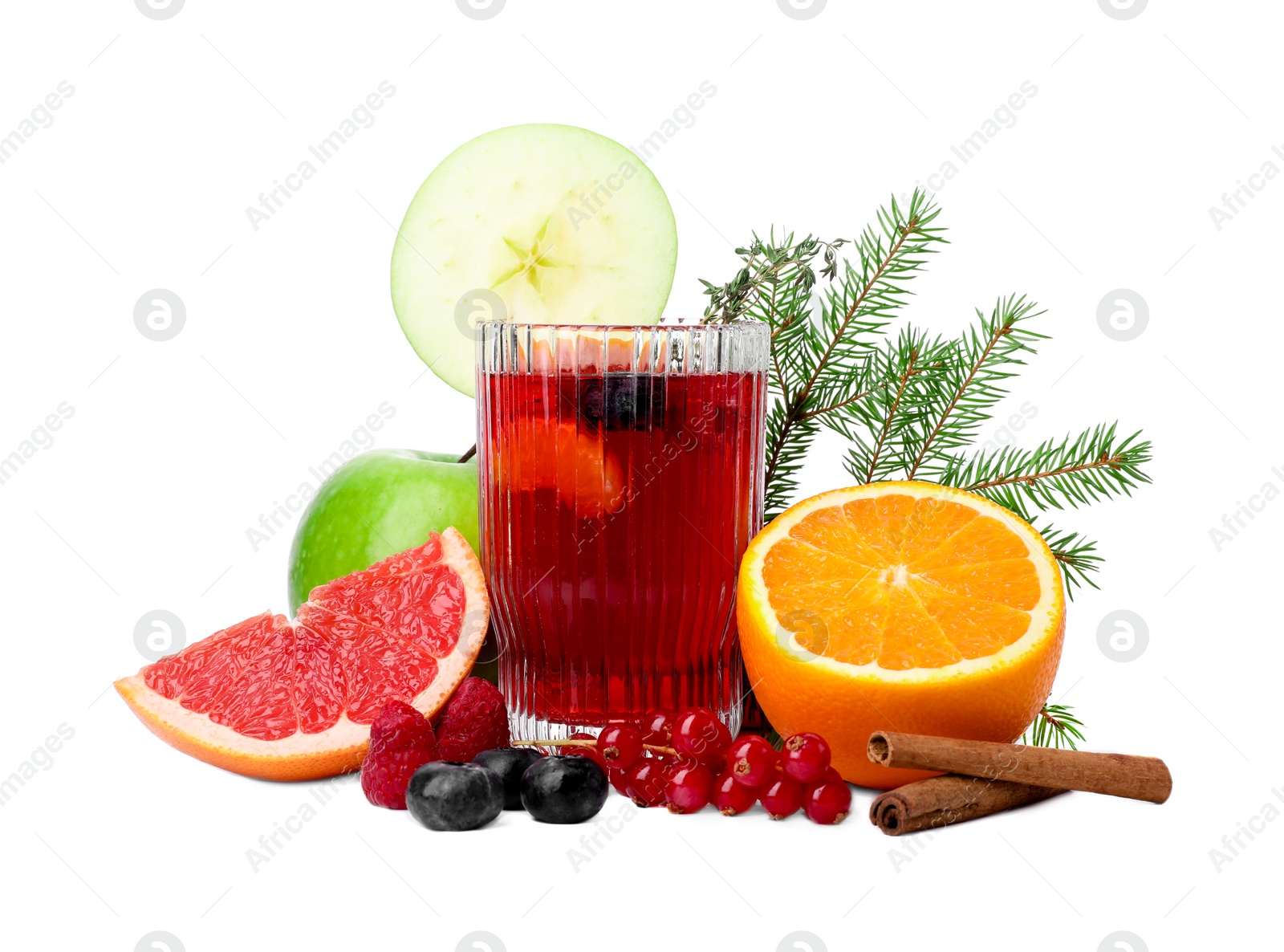 Photo of Aromatic Christmas Sangria in glass, different products and fir branches isolated on white