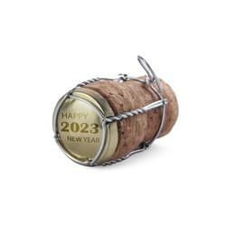 Cork of sparkling wine and muselet cap with engraving Happy 2023 New Year on white background