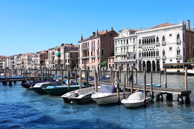 VENICE, ITALY - JUNE 13, 2019: View of Grand Canal with different boats at pier