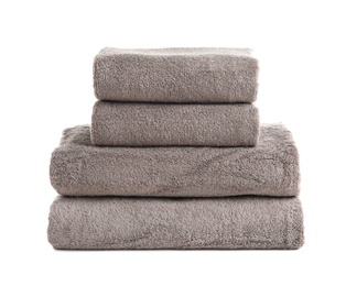 Photo of Stack of fresh towels isolated on white