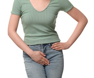 Woman suffering from cystitis on white background, closeup