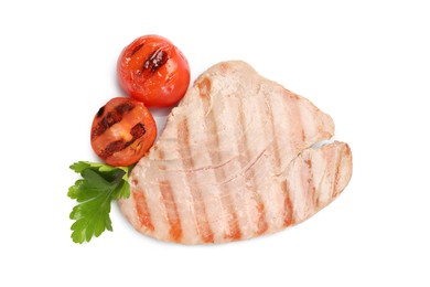 Delicious tuna steak with parsley and tomatoes isolated on white, top view