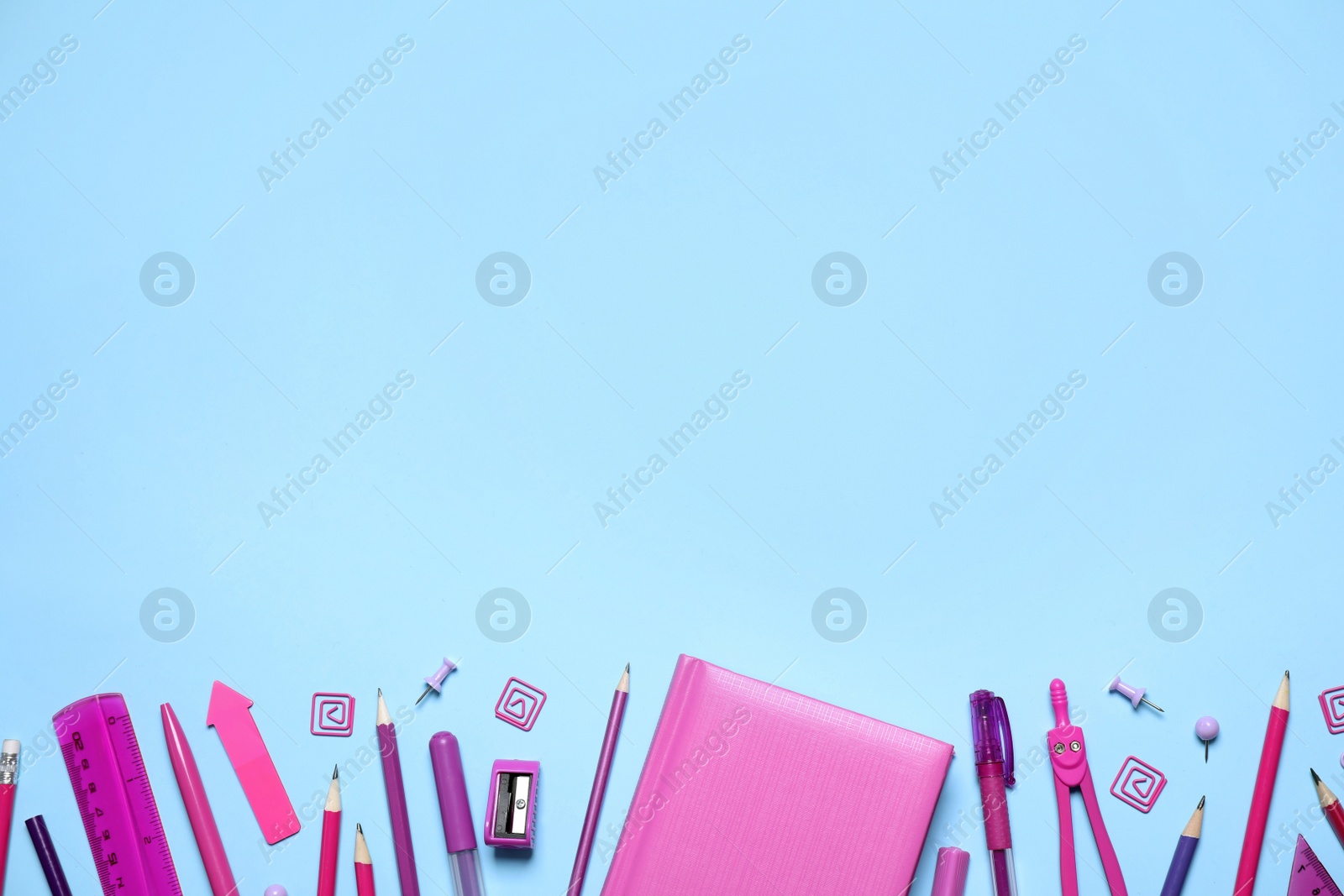 Photo of Different stationery on light blue background, flat lay. Space for text