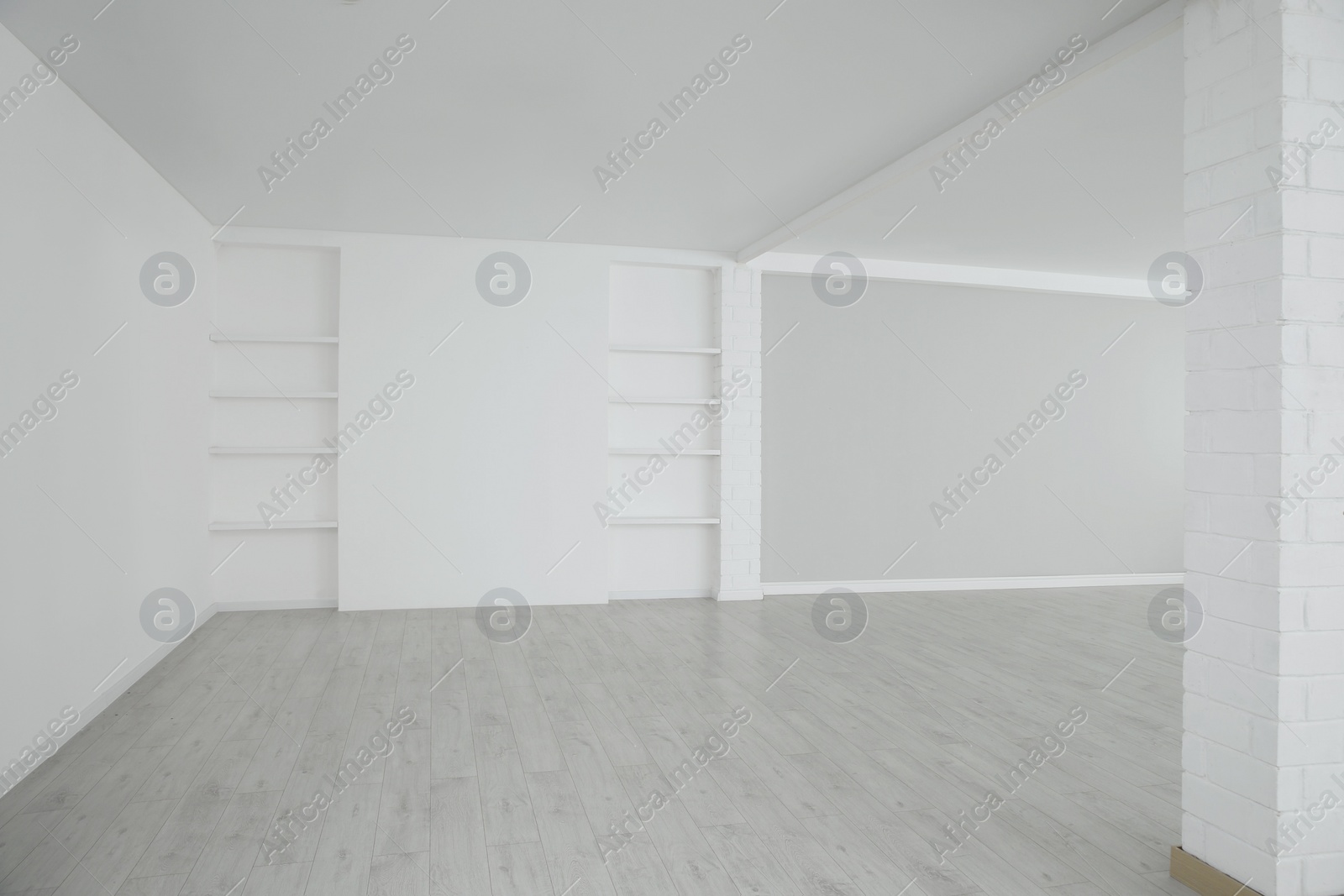 Photo of Empty room with modern ceiling fan and laminated floor