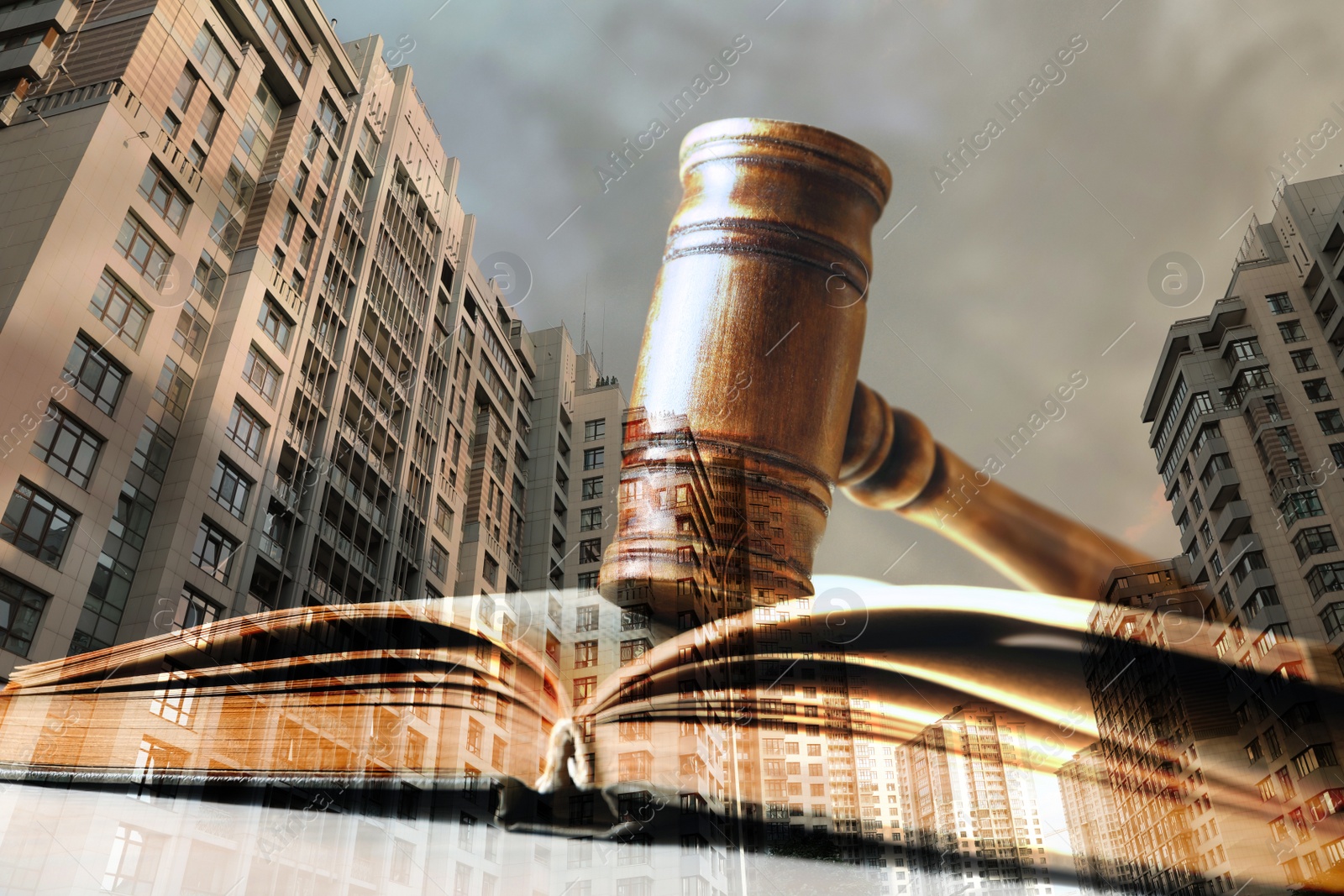 Image of Law protection. Double exposure of book with gavel and cityscape