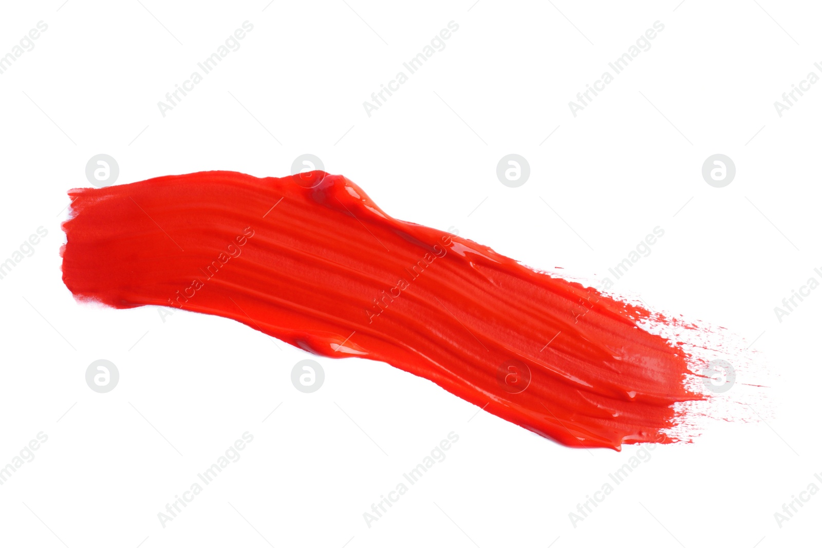 Photo of Red paint stroke drawn with brush on white background, top view