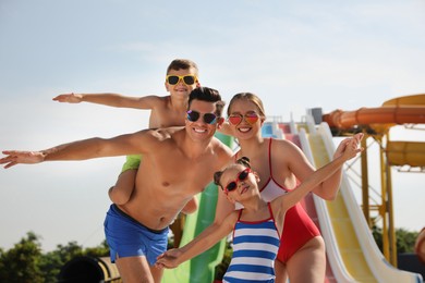 Photo of Happy family in water park on sunny day