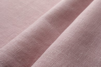 Photo of Texture of pink fabric as background, closeup