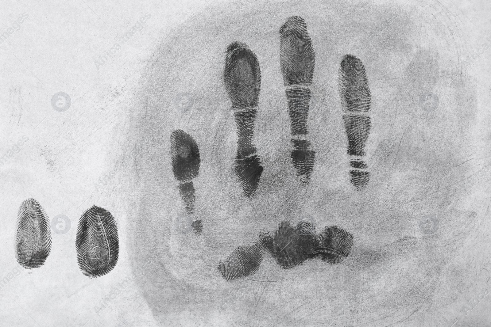 Photo of Fingerprints on light surface, top view. Forensic investigation